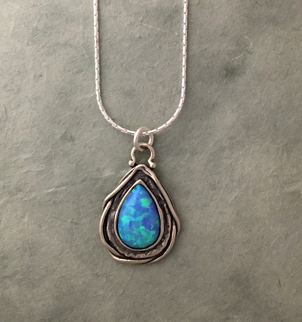 teardrop opal in silver necklace by Tamir Zuman