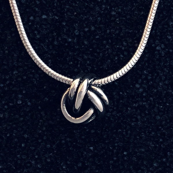 tiny knot pendant on chain