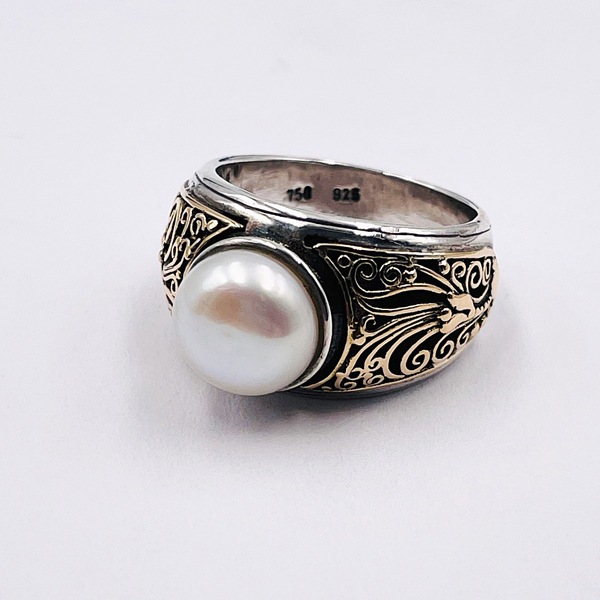 pearl in gold ring